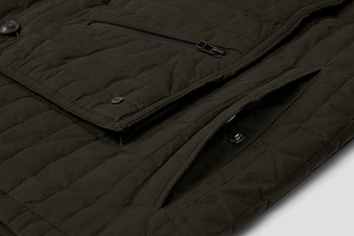 Deep hand-warmer pockets are fastened with a pop-stud.