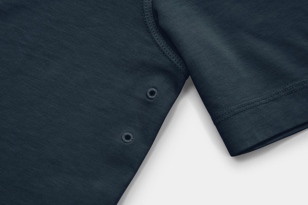 Two Embroidered Vents Under Each Arm Allow Air To Circulate.
