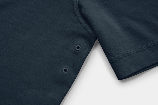 Two Embroidered Vents Under Each Arm Allow Air To Circulate.