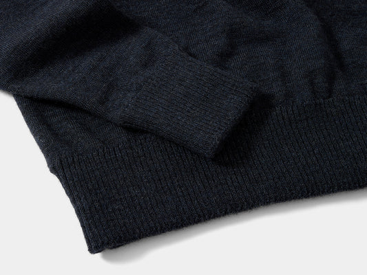 Cut long to keep wrists and lower back covered, deep rib at cuff and hem hold in warmth. Dense high-tension knit will hold its shape. 