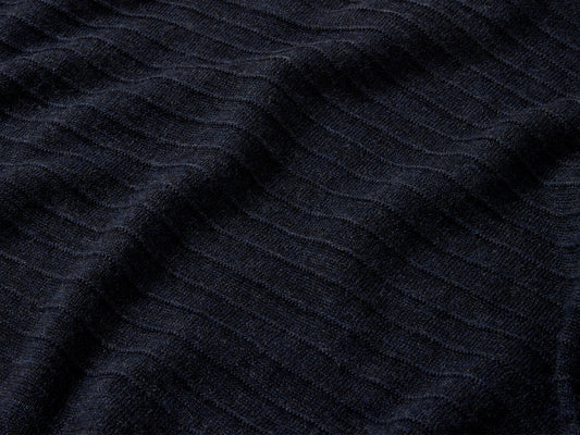 Upper body and sleeves feature signature garter stitch motif, a contemporary take on a traditional guernsey detail.