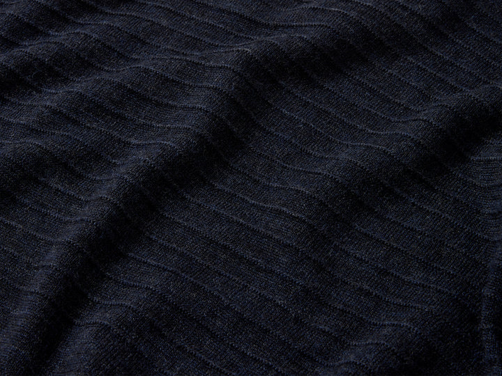 Upper body and sleeves feature signature garter stitch motif, a contemporary take on a traditional guernsey detail.