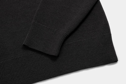 The body and sleeves are cut long to keep wrists and lower back covered.