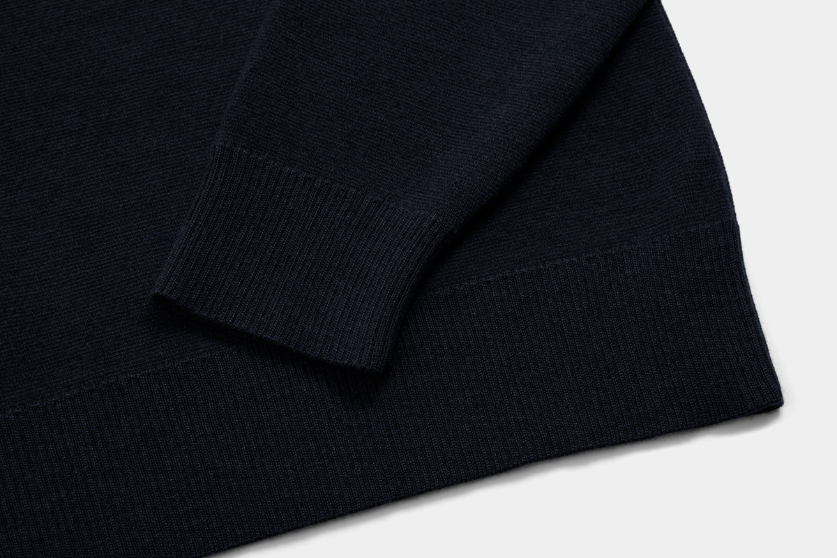 The body and sleeves are cut long to keep wrists and lower back covered.