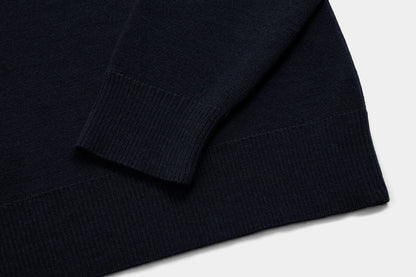 The body and sleeves are cut long to keep wrists and lower back covered.