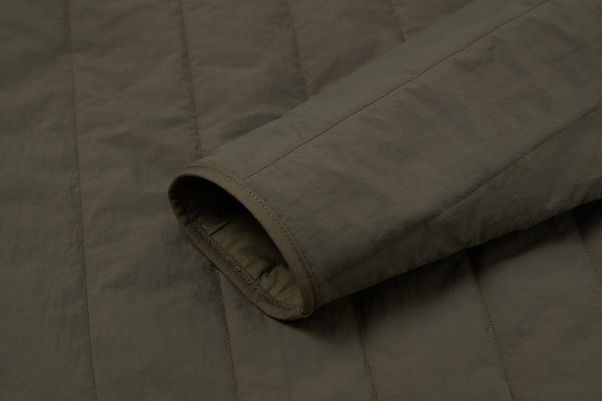 Water resistant durable Nilon shell - strong, quick-drying, resistant to wear. Cuff, placket and hem are bound with a hardwearing ripstop fabric.