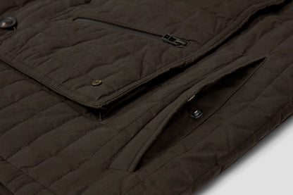 Deep hand-warmer pockets are fastened with a pop-stud.