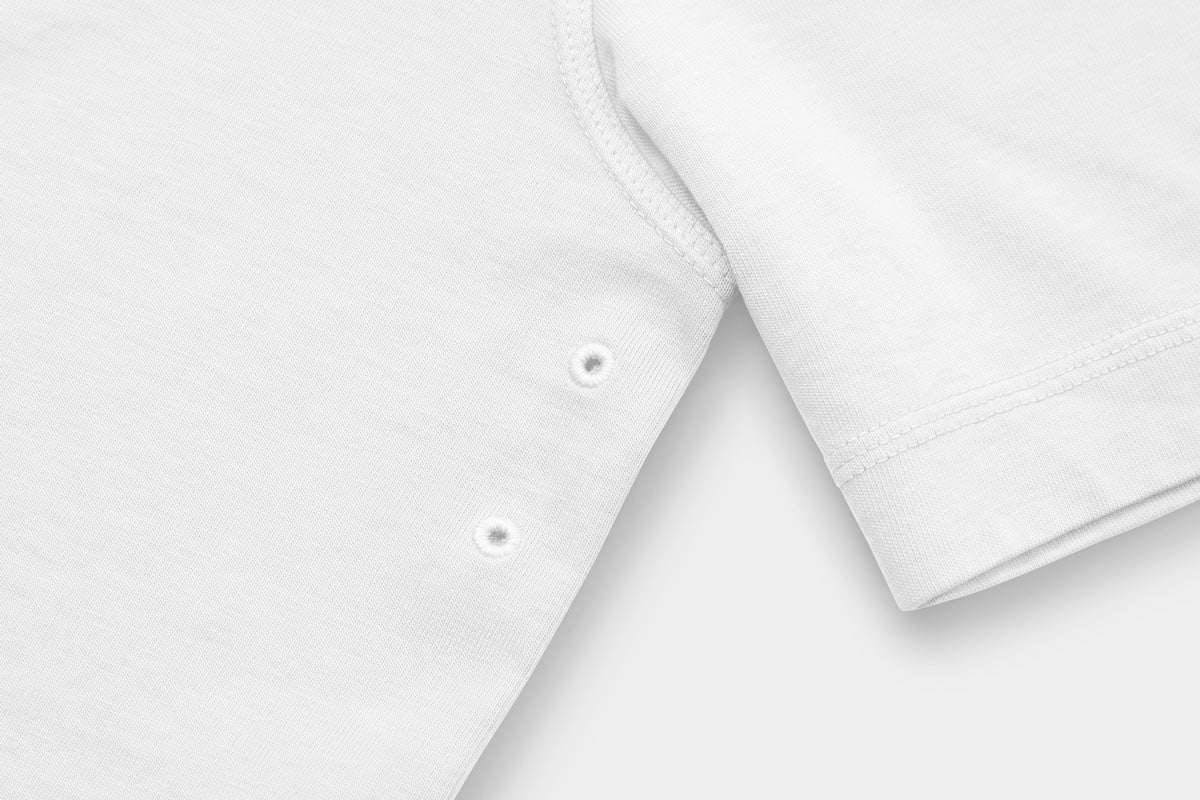 Two Embroidered Vents Under Each Arm Allow Air To Circulate.