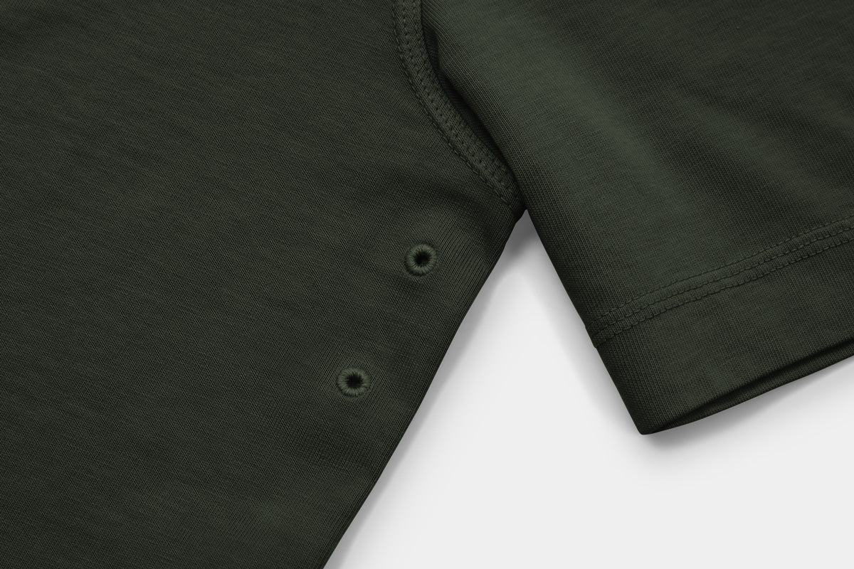 Two Embroidered Vents Under Each Arm Allow Air To Circulate.