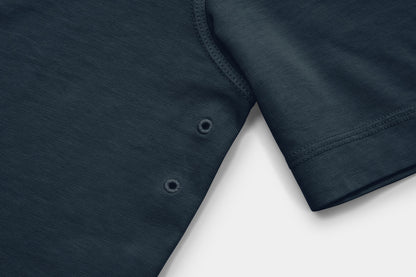 Two Embroidered Vents Under Each Arm Allow Air To Circulate.