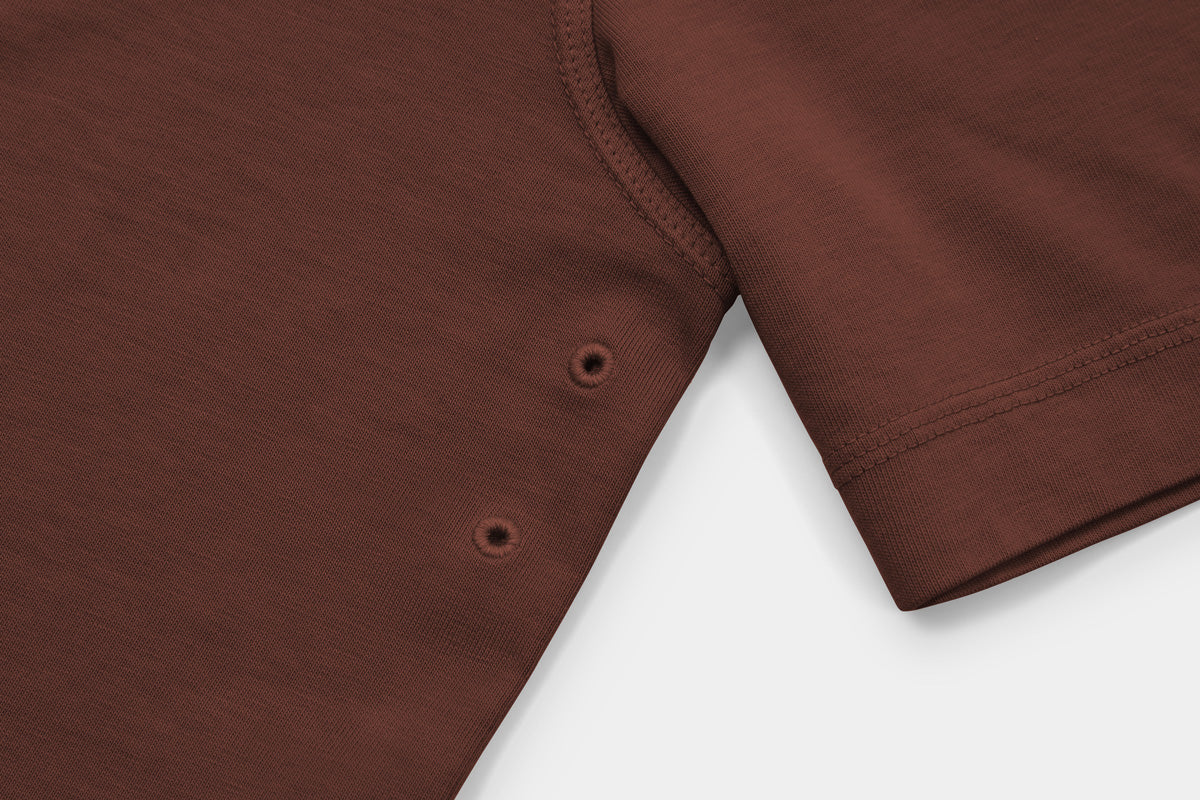 Two Embroidered Vents Under Each Arm Allow Air To Circulate.