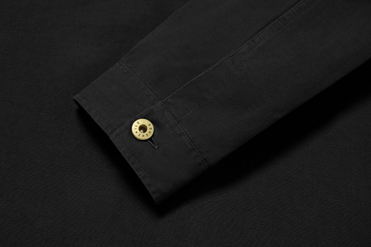 Solid brass buttons on the placket, pocket, cuff are stamped with Roughchild type. 
